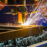 Precision metal laser cutting service in Dubai on steel sheet.