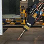 Bevel laser cutting process on steel structure in Dubai industrial project